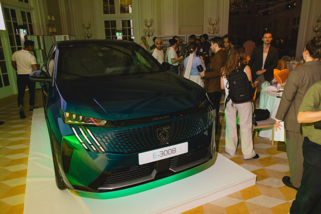 A PEUGEOT E-3008 parked in the Raffles ballroom